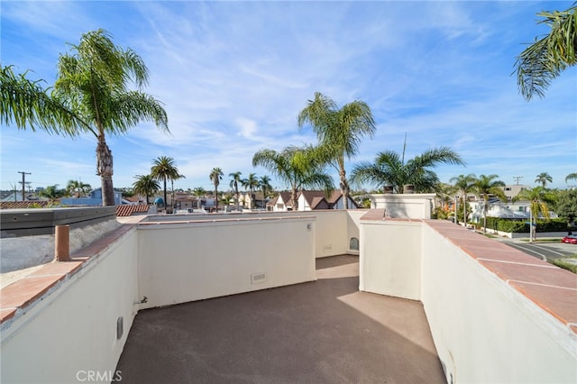 view of patio featuring a balcony