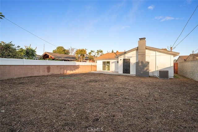 back of property featuring central air condition unit