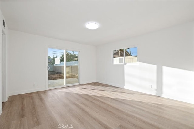 unfurnished room featuring light wood-type flooring