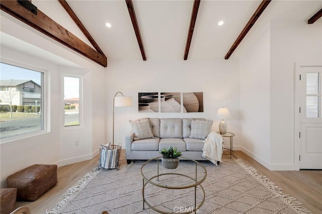 living area with lofted ceiling with beams, light wood finished floors, baseboards, and recessed lighting