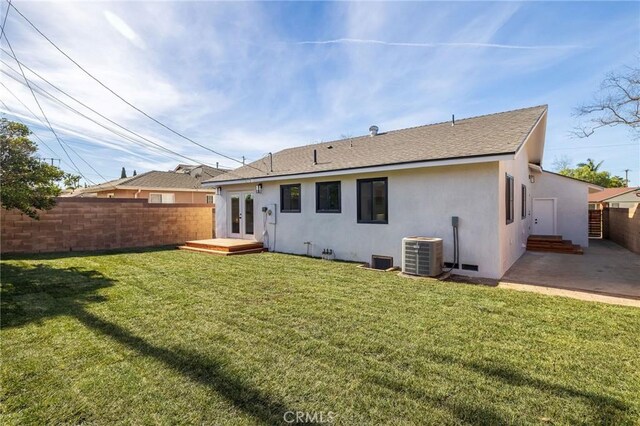 back of house with a yard, central AC, and a patio area