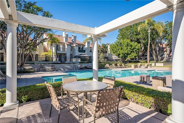 view of swimming pool featuring a patio area