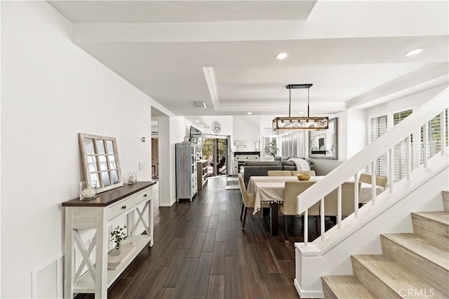 dining area with a raised ceiling