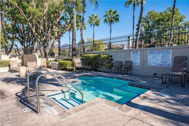 view of swimming pool featuring a patio area