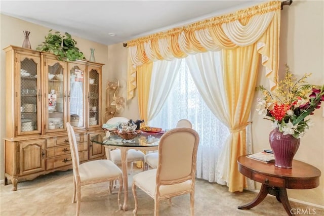 view of carpeted dining space