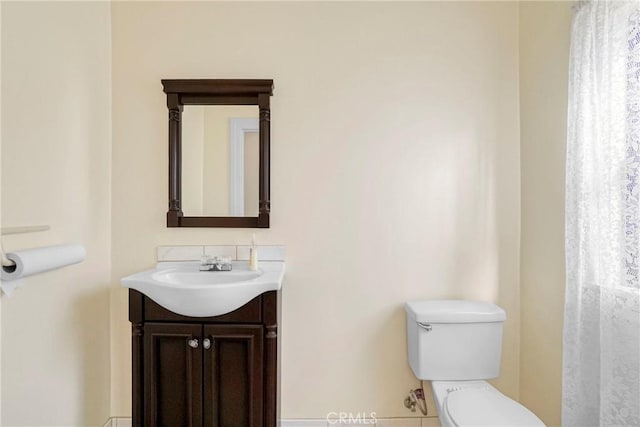 bathroom with vanity and toilet