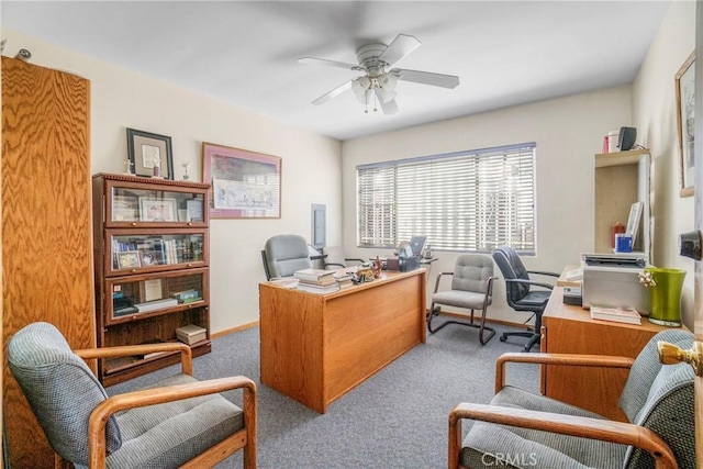 home office featuring carpet floors and ceiling fan