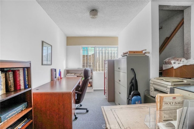 office area with a textured ceiling