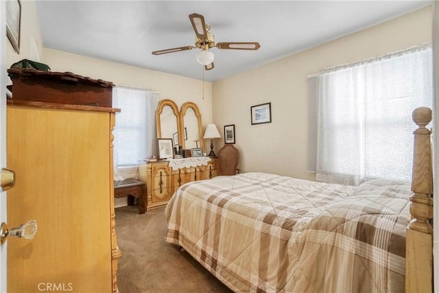 bedroom with ceiling fan and carpet