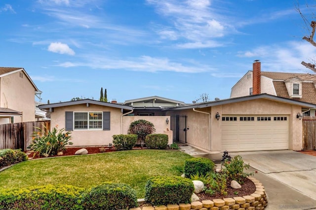 view of front of house with a garage and a front yard