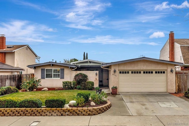 ranch-style house with a garage and a front yard