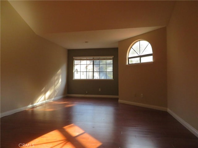 spare room featuring dark hardwood / wood-style flooring