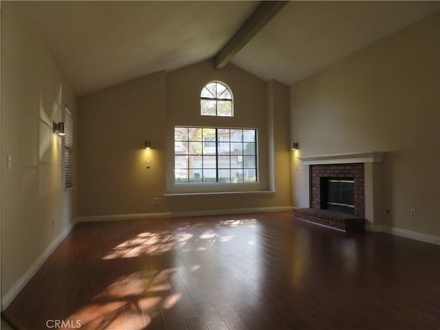 unfurnished living room featuring dark hardwood / wood-style flooring, vaulted ceiling with beams, and a fireplace