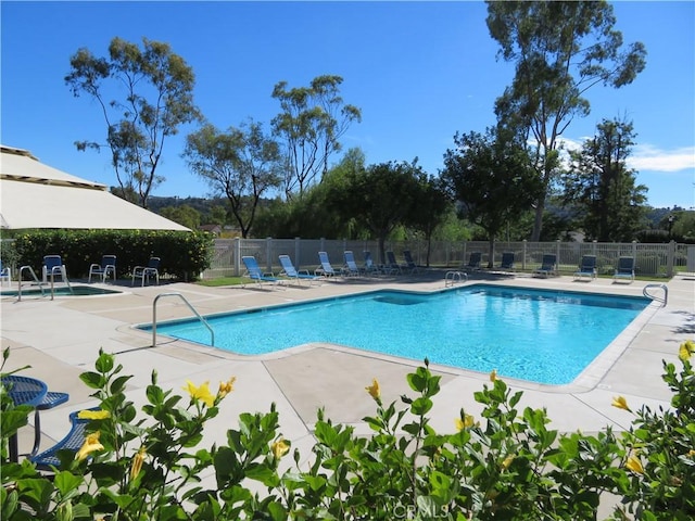 view of swimming pool with a patio area