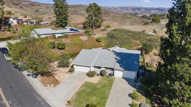 drone / aerial view featuring a mountain view