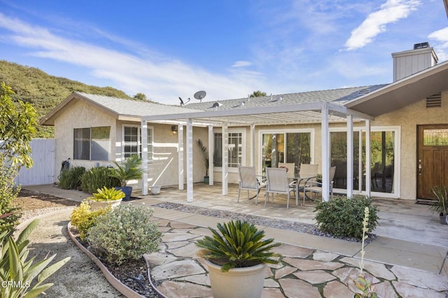 rear view of house featuring a patio