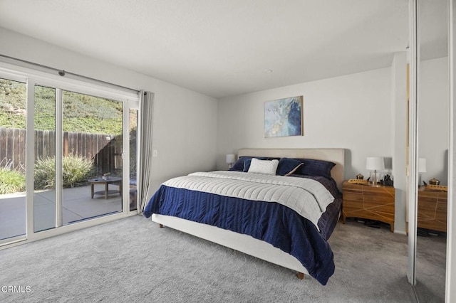 carpeted bedroom featuring access to outside