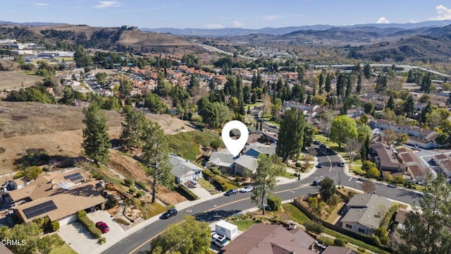 birds eye view of property featuring a mountain view