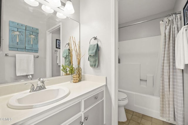 full bathroom with shower / tub combo with curtain, vanity, tile patterned flooring, and toilet