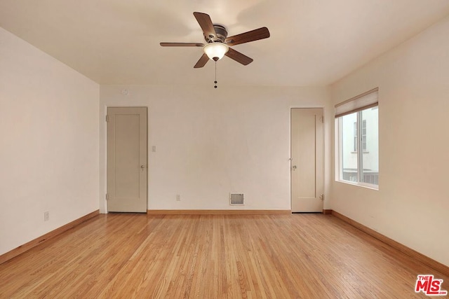 unfurnished room featuring light hardwood / wood-style floors and ceiling fan