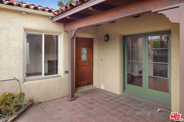 doorway to property with french doors and a patio area