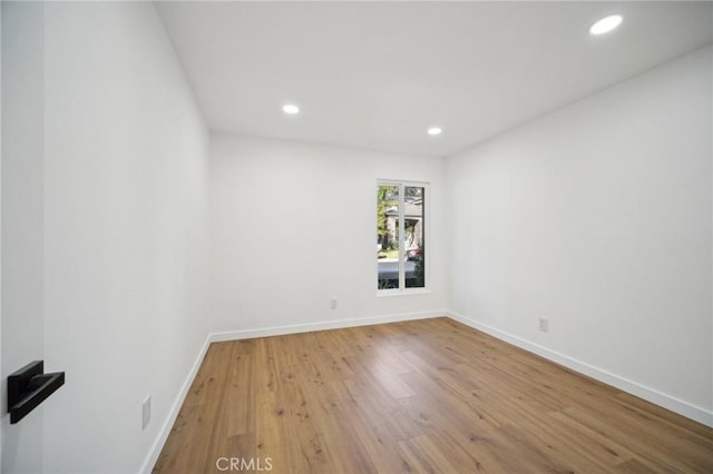 spare room featuring hardwood / wood-style floors