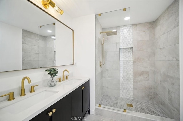 bathroom featuring vanity and a tile shower