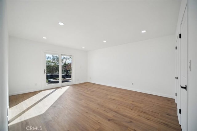 unfurnished room featuring light hardwood / wood-style floors