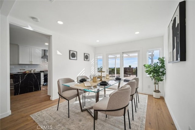 dining space featuring light wood-type flooring