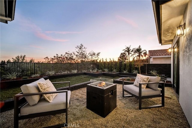 patio terrace at dusk with a fire pit