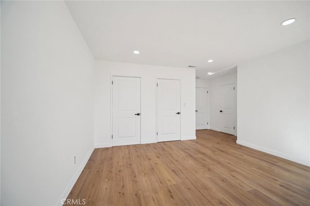 unfurnished bedroom featuring light hardwood / wood-style floors