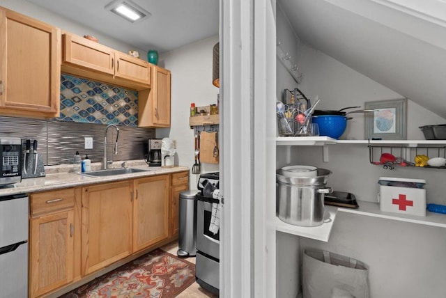 kitchen with light brown cabinetry, sink, backsplash, and appliances with stainless steel finishes