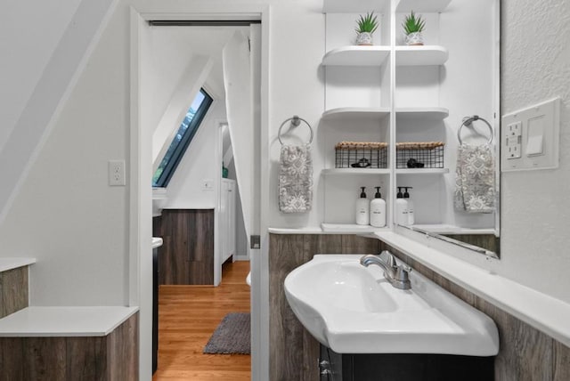 bathroom with vanity and hardwood / wood-style floors