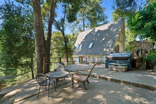 view of patio / terrace featuring area for grilling and a hot tub