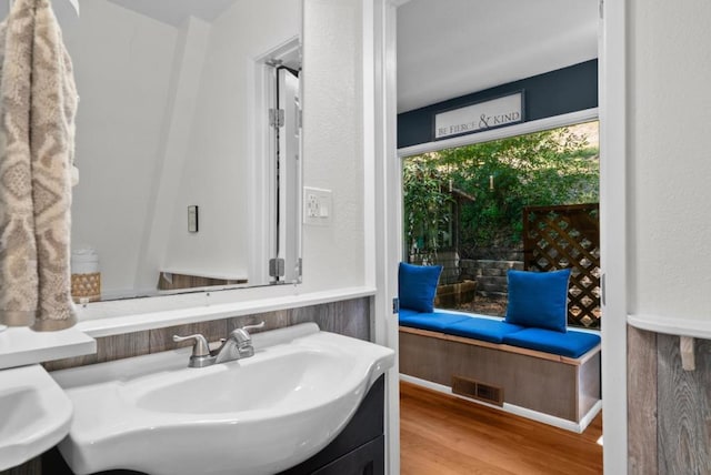 bathroom with hardwood / wood-style flooring and sink