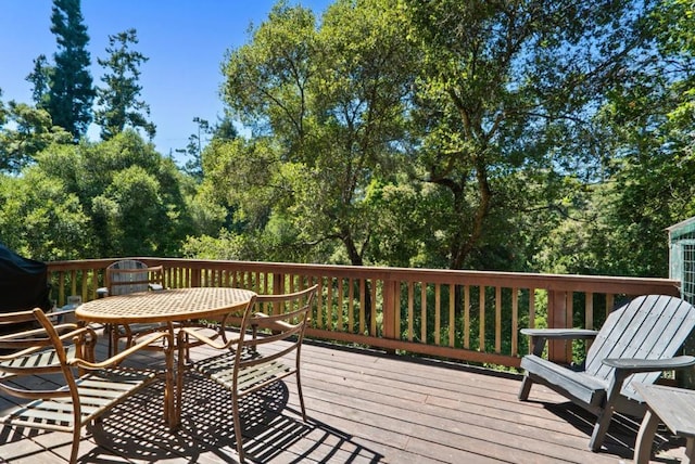 wooden terrace featuring grilling area