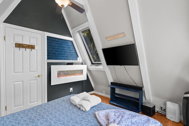 bedroom featuring hardwood / wood-style floors and ceiling fan