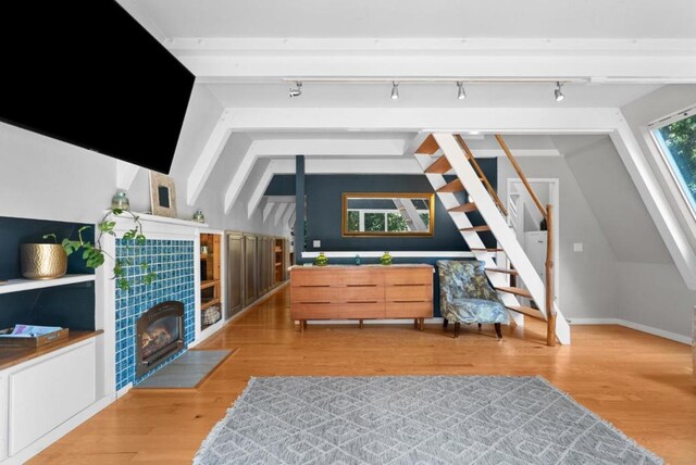 interior space with lofted ceiling and light wood-type flooring