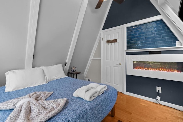 bedroom with hardwood / wood-style flooring and ceiling fan