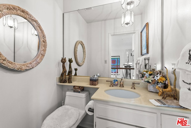 bathroom with vanity and toilet