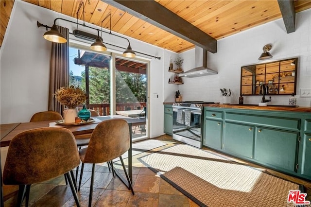 kitchen featuring green cabinetry, beam ceiling, stainless steel stove, and wall chimney range hood