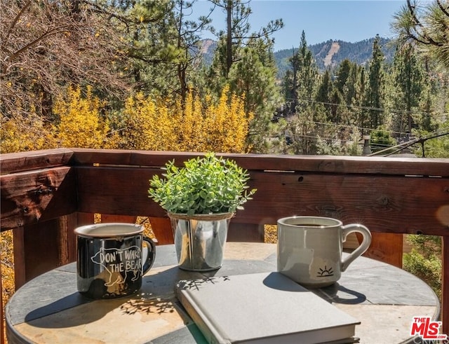 view of patio / terrace featuring a mountain view