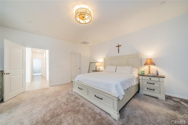 bedroom featuring light carpet