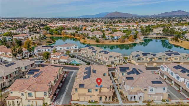 bird's eye view featuring a water and mountain view