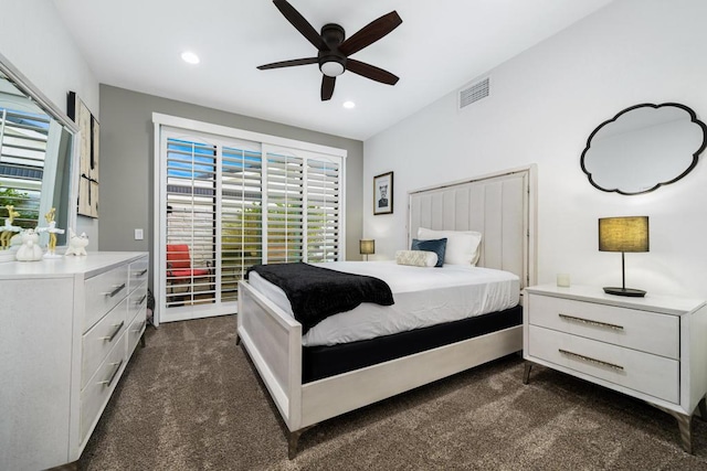 bedroom with ceiling fan and dark colored carpet