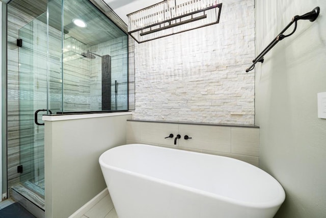 bathroom featuring tile patterned floors and plus walk in shower