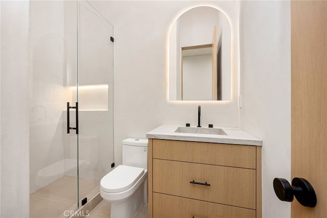 bathroom featuring walk in shower, tile patterned floors, vanity, and toilet