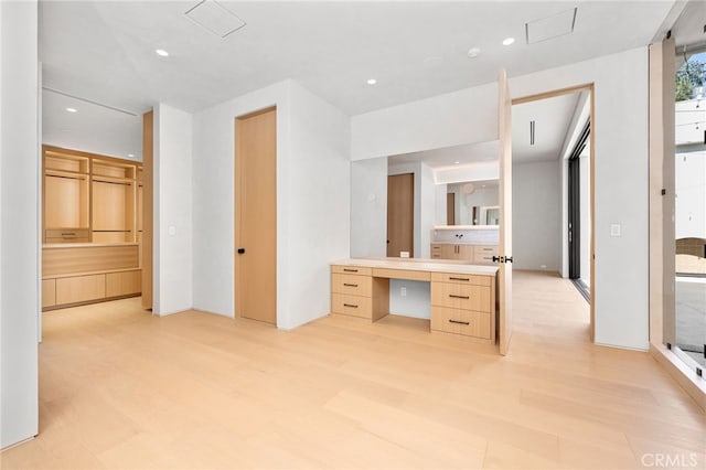 bathroom with hardwood / wood-style floors