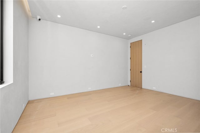 empty room with light wood-type flooring