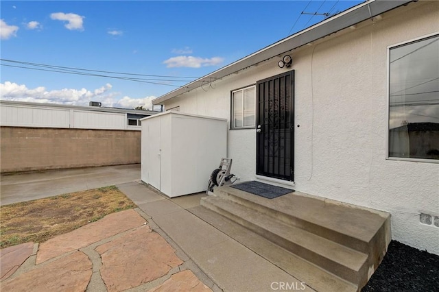 property entrance with a patio area